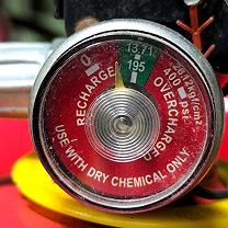 Fire extinguisher pressure gauge in green safe zone